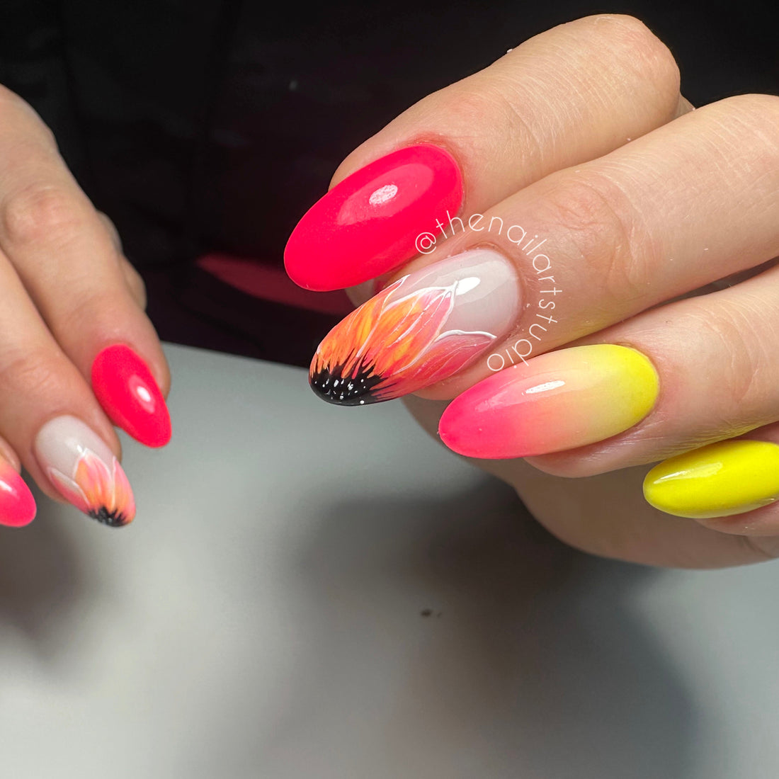 Pink and yellow gel nails with ombre and flower nail art